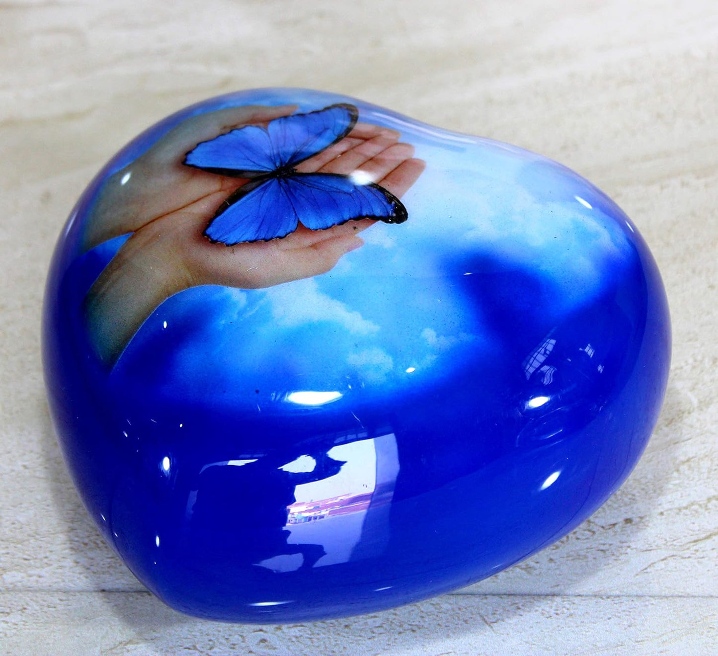 eSplanade Metal Heart-shaped Urn in Hands Stand Cremation Memorial Jar Pot Container | Medium Size Urn for Funeral Ashes Burial | Butterfly Printed Urn | Blue - 6" Inches