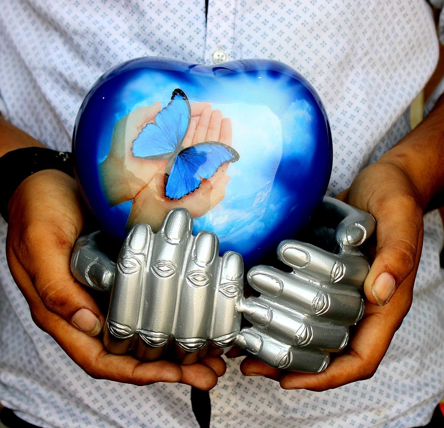 eSplanade Metal Heart-shaped Urn in Hands Stand Cremation Memorial Jar Pot Container | Medium Size Urn for Funeral Ashes Burial | Butterfly Printed Urn | Blue - 6" Inches