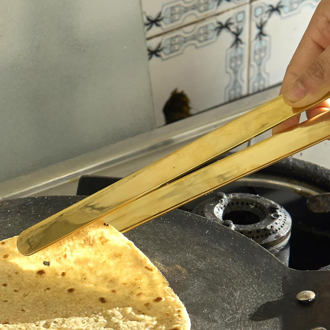 Multi-purpose tool ideal for cooking rotis, grilling, flipping, and serving food.