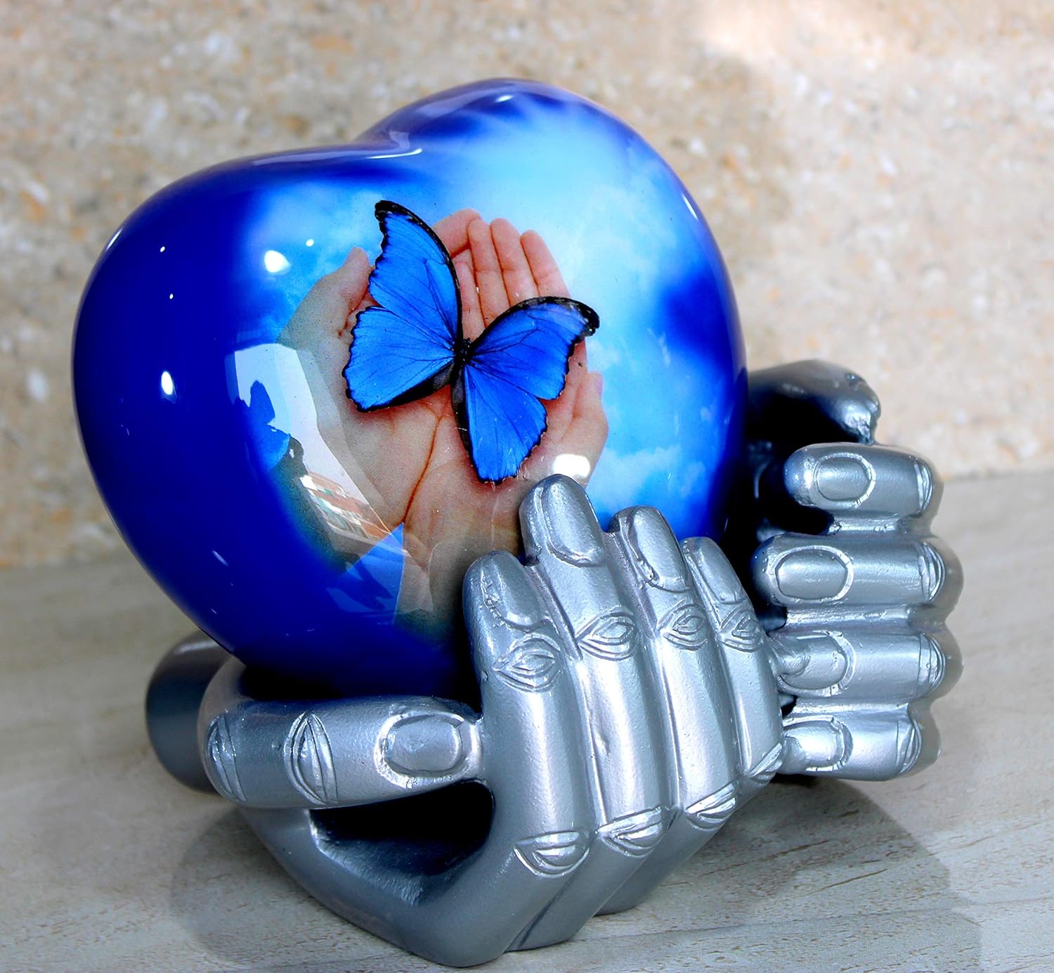 eSplanade Metal Heart-shaped Urn in Hands Stand Cremation Memorial Jar Pot Container | Medium Size Urn for Funeral Ashes Burial | Butterfly Printed Urn | Blue - 6" Inches