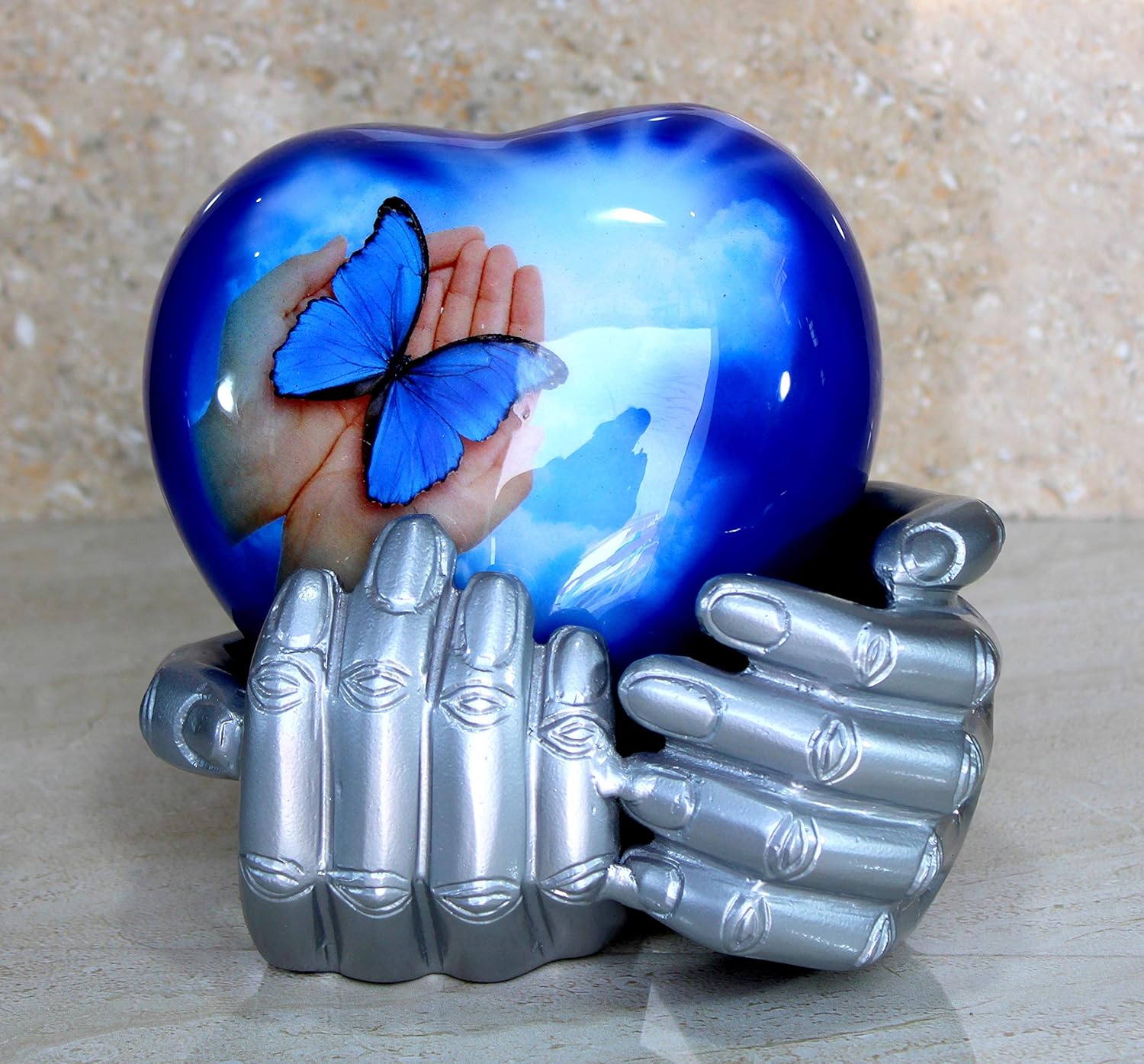 eSplanade Metal Heart-shaped Urn in Hands Stand Cremation Memorial Jar Pot Container | Medium Size Urn for Funeral Ashes Burial | Butterfly Printed Urn | Blue - 6" Inches